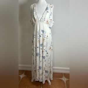 White dress with flowers. Used but in good condition. Size 14